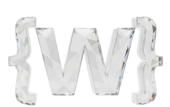 A crystal-like letter "W" flanked by two crystal curly braces, all with a faceted, reflective surface, evokes the elegance of exclusive web design against a plain white background.