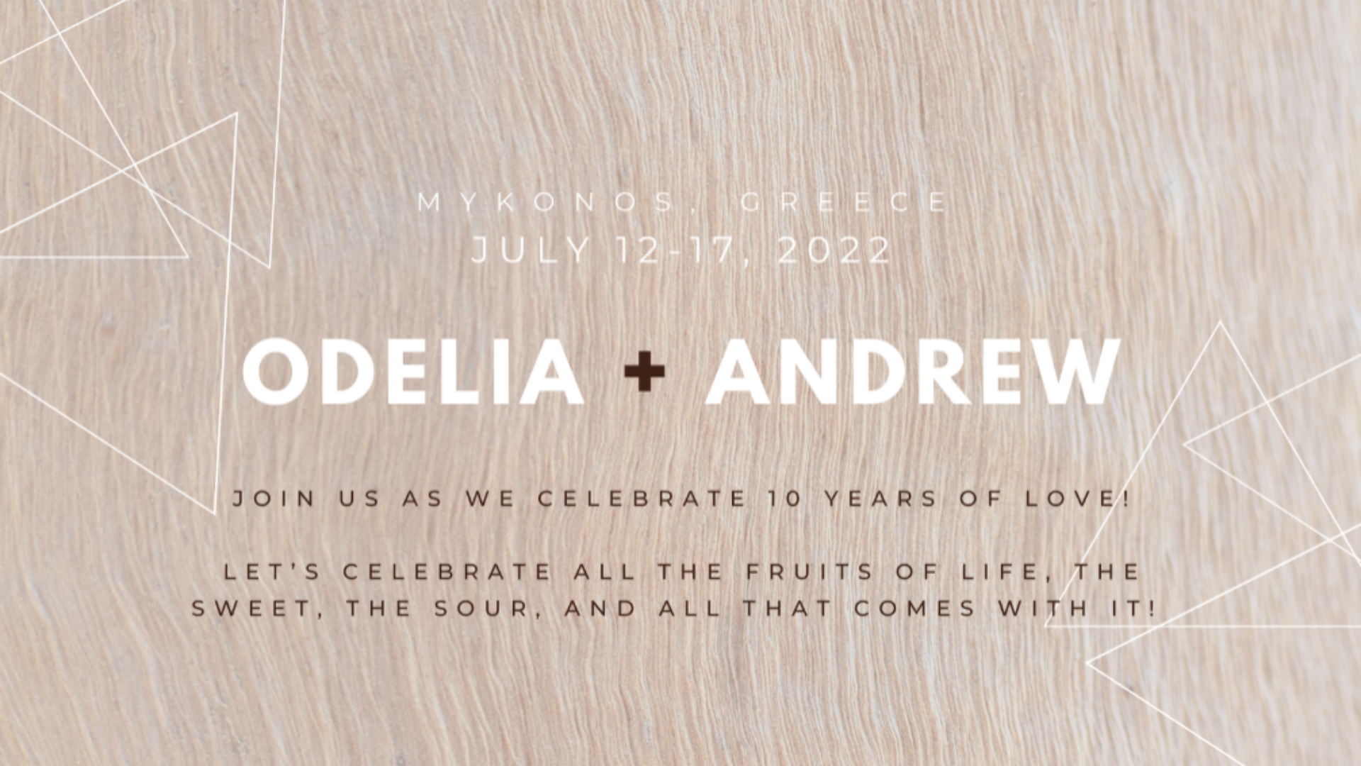 Invitation graphic with a beige textured background. Text reads: "Mykonos, Greece, July 12-17, 2022. Odelia + Andrew. Celebrate 10 years of love! Discover our bespoke wedding website and join us for all the fruits of life: the sweet, the sour, and more!.